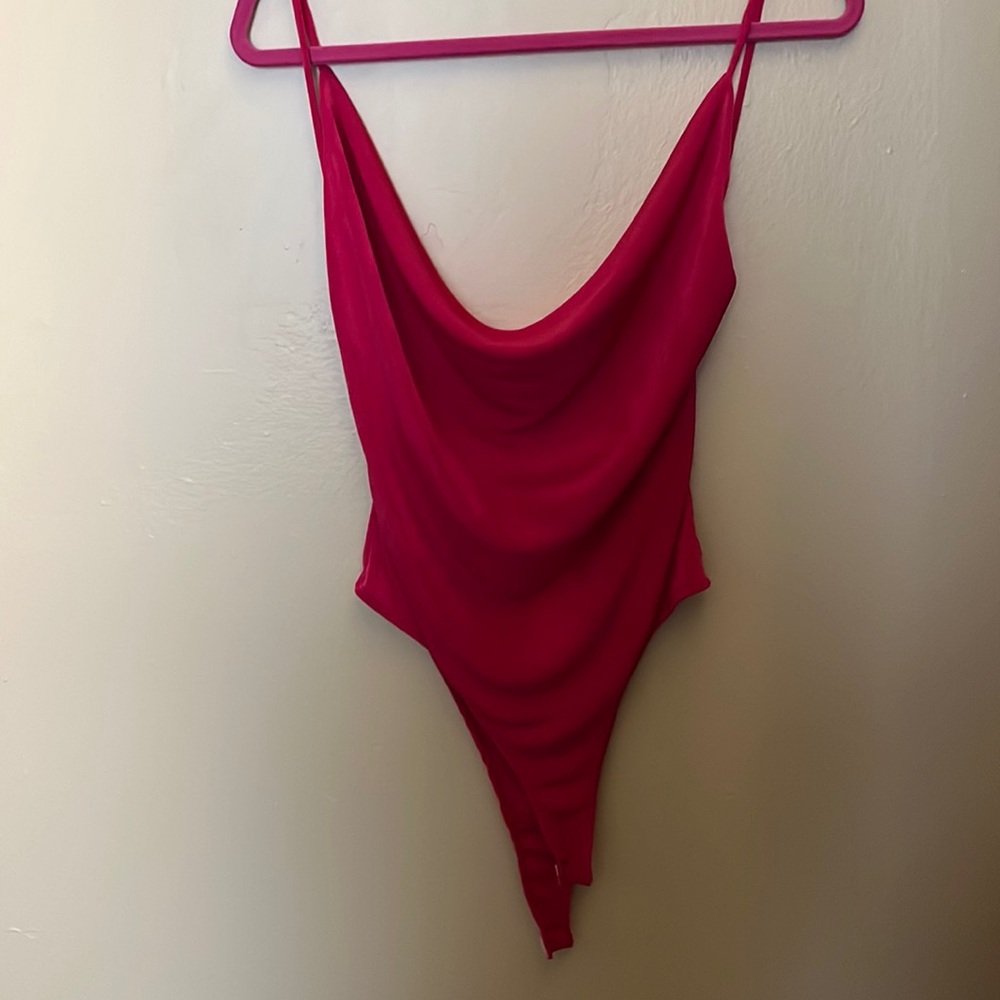 Bright pink body suit